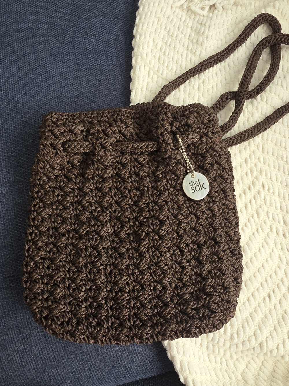 The Sak Brown Crochet Drawstring Crossbody Bag